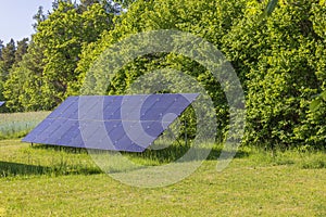 Close-up view of big solar panel installed on ground.