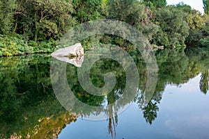 Close up view of big white stone in the river Cetina