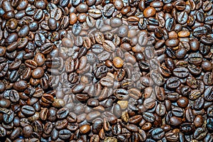 Close-up view of black coffee beans after roasting.