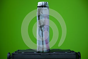 Close up view of black colored ink bottle which is used in color printer.