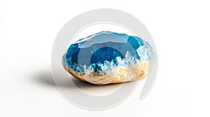 A close-up of a blue agate stone with a unique crystal formation on a white background photo