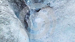 Close-up view of the blue ice with streaming water on the jokulsarlon glacier in Iceland