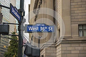 Close up view of blue road sign direction West 36th  street and Broadway. New York.