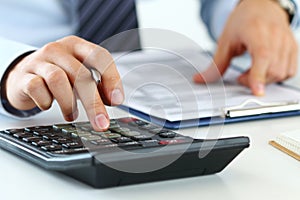 Close up view of bookkeeper or financial inspector hands making photo