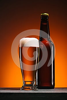 close up view of bottle and mug of beer