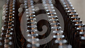 close-up view of bottles on conveyor belt, close-up, modern brewery, bottling workshop