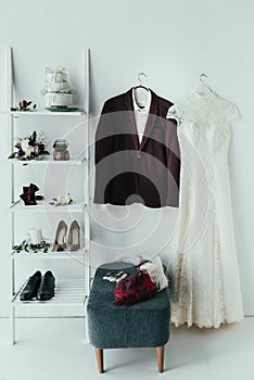 close up view of bridal and grooms clothing and accessories for rustic wedding