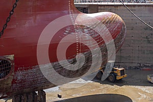 Close up view on the bulbous bow of the big container ship.
