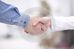 Close up view of business partnership handshake concept.Photo of two businessman handshaking process.Successful deal