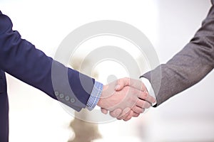 Close up view of business partnership handshake concept.Photo of two businessman handshaking process.Successful deal
