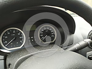 Close-up view in car dashboard with instruments of measurement in car cockpit with instrument panel for speeding and speedometer