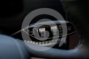 Close up view of car light switch control. Headlight switch, turn signal lever