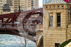 Close-up view of a car passing over a Chicago bridge spanning the frozen Chicago River.