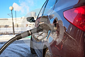 Close up view of car refuel in gas station photo