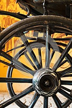 Close up view of carriage wheels with long spokes