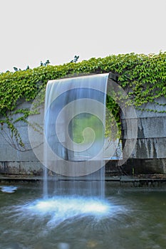 Close-up view of a cascading feature water fountain in a public park.