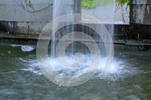 Close-up view of a cascading feature water fountain in a public park.