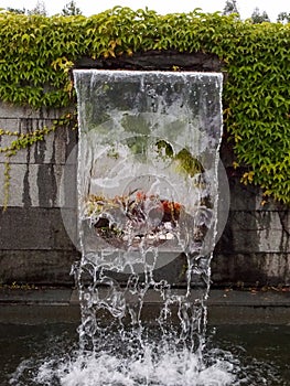 Close-up view of a cascading feature water fountain in a public park.