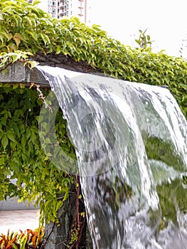 Close-up view of a cascading feature water fountain in a public park.