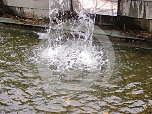 Close-up view of a cascading feature water fountain in a public park.