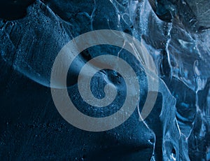 Close-up view in a cave of the blue glacier ice