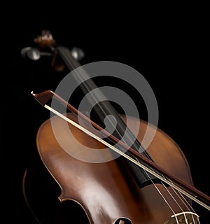 Close up view of a Cello and bow.