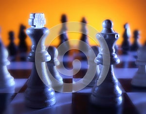 Close up view of chess board with king and queen in foreground