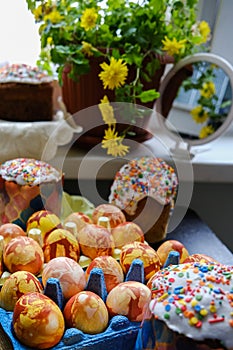 Close-up view of chicken eggs, homemade easter cake and willow twigs