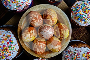 Close-up view of chicken eggs, homemade easter cake and willow twigs