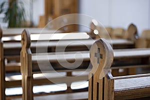 A close up view of a church bench without people