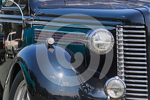 Close up view of classic black car front end