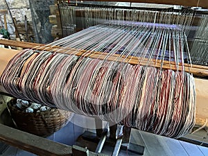 Close-up of Wool on a Weaverâs Loom Inside an 1800âs Recreated Home in Spring Mill State Park photo