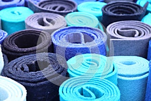 Close up view on colorful hanging and folded fabrics and textiles in high resolution found on a fabrics market in Flensburg