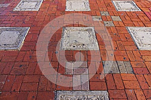 Close up view of colorful paving slabs as background texture on street.