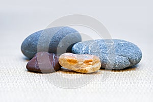 Close up view of colorful stones on grey background