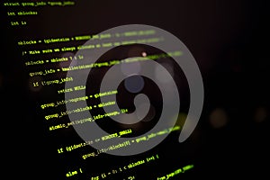 Close-up view of computer programming code on a dark screen, representing software development, cybersecurity, coding, and IT