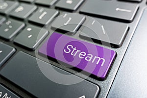 Close up on conceptual keyboard - Stream key. presses color button on gray keyboard