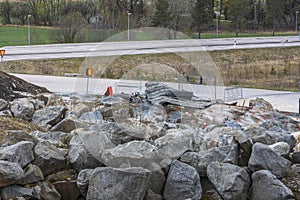 Close up view of construction imploding works on rocky terrain.