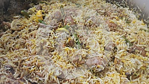 A close up view of cooked rice chicken biryani made with traditional recipe