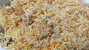 A close up  view of cooked rice chicken biryani made with traditional recipe