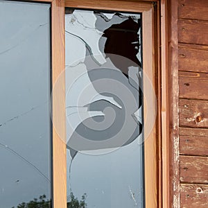 Close up view of cracked and broken glass window