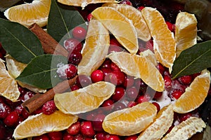 Close up view of cranberry sauce with oranges, cinnamon and bay