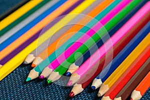 Close up view of crayons. Colored Pencils. Colored pencils on wooden background.