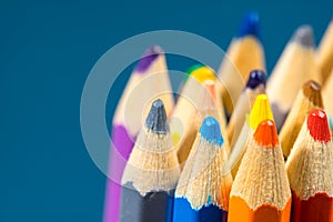 Close up view of crayons. Colored Pencils. Colored pencils on wooden background.