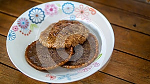 Close up view of Cucur Jawa or Cucur Topi, a traditional Malay food in a white plate