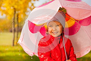 Close up view of cute small girl holding umbrella