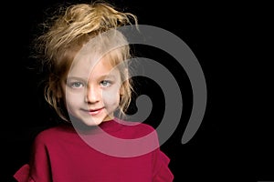 Close Up View of Cute Smiling Blonde Girl Posing on Black Background.