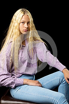 Close Up View of Cute Smiling Blonde Girl Posing on Black Background