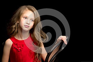 Close Up View of Cute Smiling Blonde Girl Posing on Black Background.