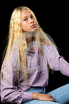 Close Up View of Cute Smiling Blonde Girl Posing on Black Background